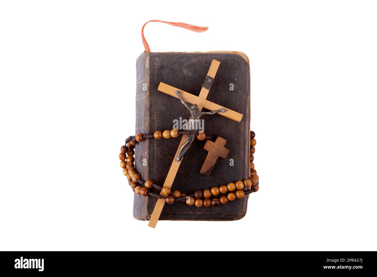 Ein altes Gebetsbuch oder die Heilige Bibel, ein christliches Kreuz und ein Rosenkranz, abstraktes Konzept, niemand Christentum, katholische Symbole Religion, Religion, Spirituali Stockfoto