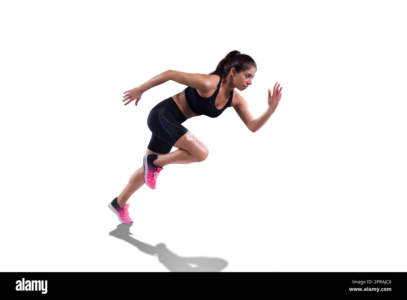 Athletische Frau läuft schnell isoliert auf weißem Hintergrund Stockfoto