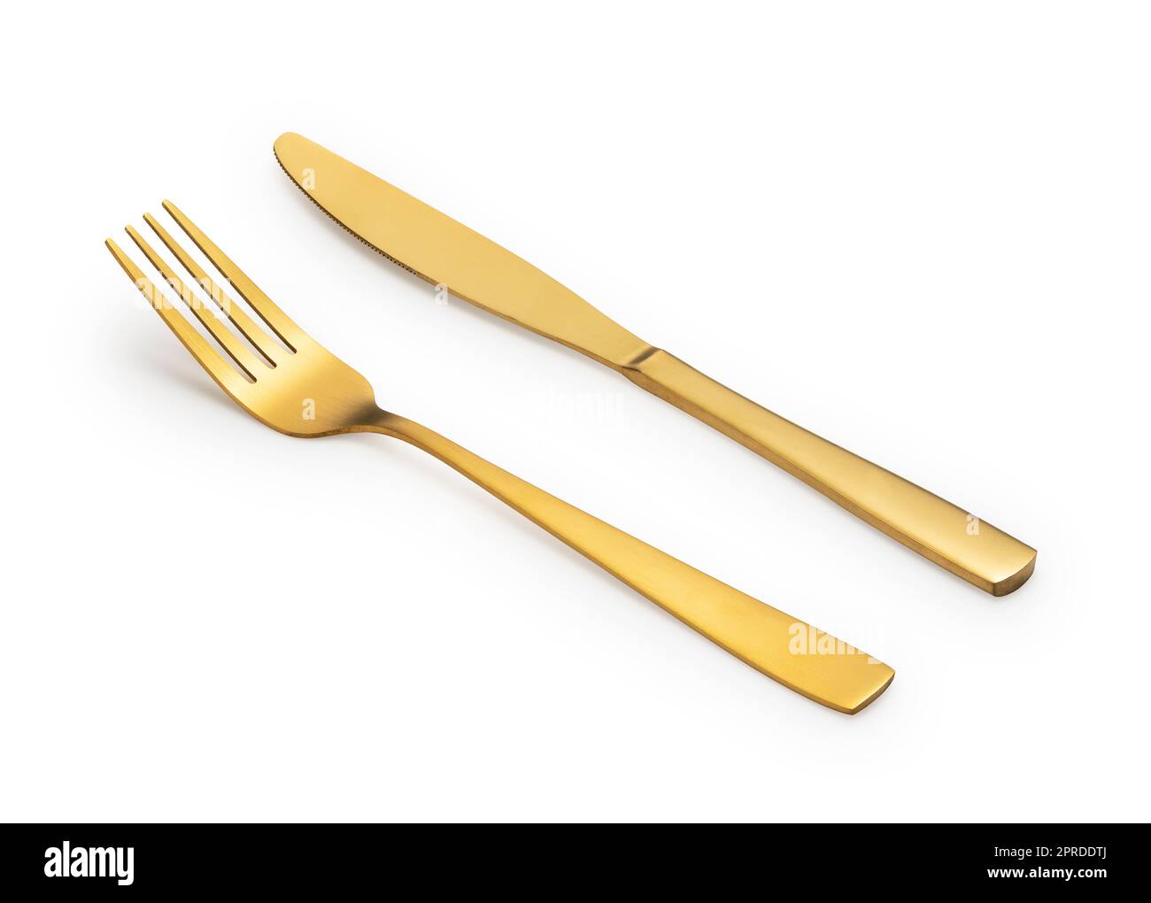 Goldene Messer und Gabeln auf weißem Hintergrund. Stockfoto