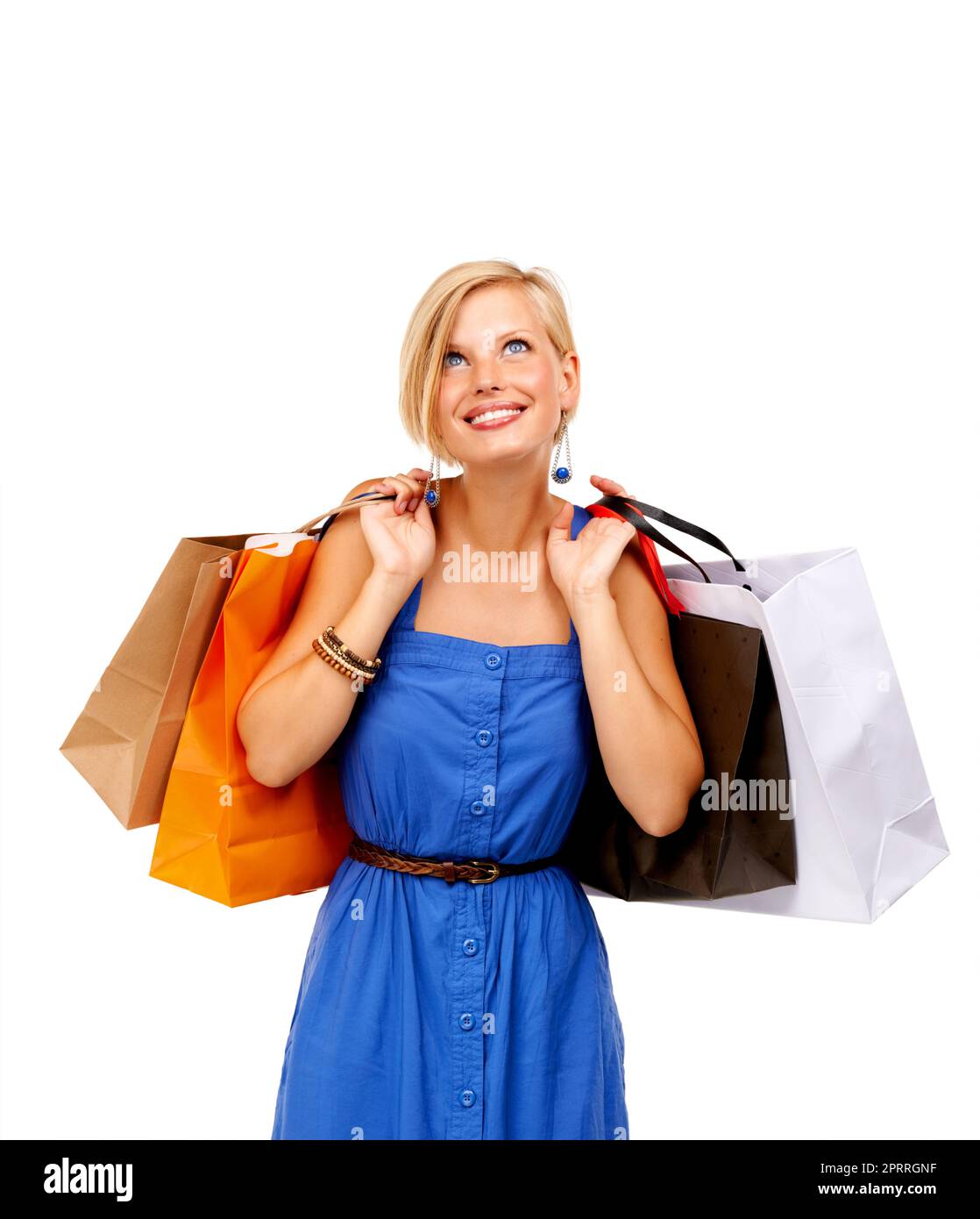 So viele Verkäufe, so wenig Zeit. Eine attraktive junge Frau mit einem Haufen Einkaufstaschen. Stockfoto