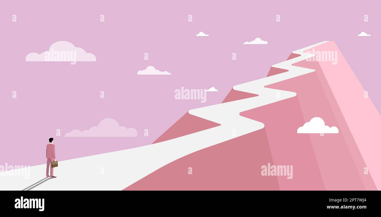 Mann auf Einem Berg, der stolz auf seinen Klettererfolg in die Wolken zieht. Stockfoto