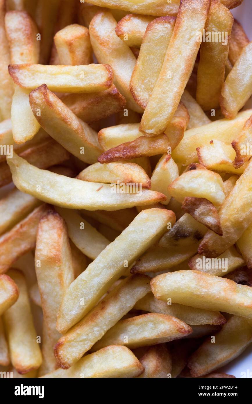 Sfondo Creato con patatine fritte, Cibo pro Fast Food Stockfoto
