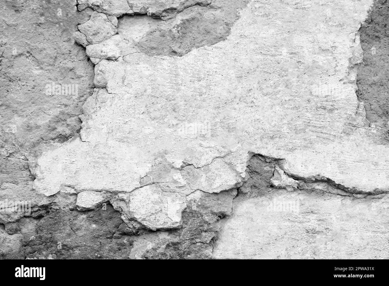 Die Konsistenz alter Steinwände mit kollabiertem Putz. Hintergrund einer schäbigen Gebäudefläche. Zerstörte Steinwand mit heruntergefallenem Gips. Verwitterte Oberfläche. Stockfoto Die Konsistenz alter Steinwände mit kollabiertem Putz. Hintergrund einer schäbigen Gebäudefläche. Zerstörte Steinwand mit heruntergefallenem Gips. Verwitterte Oberfläche. Stockfoto
