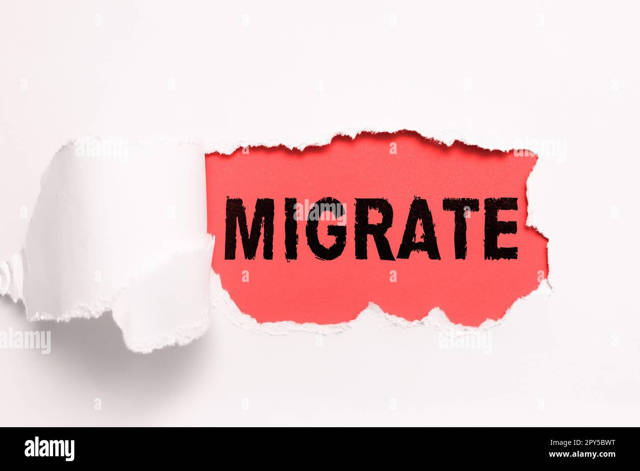 Inspiration mit dem Zeichen Migrate. Wort für, um von einem Land oder Ort in ein anderes zu reisen Stockfoto