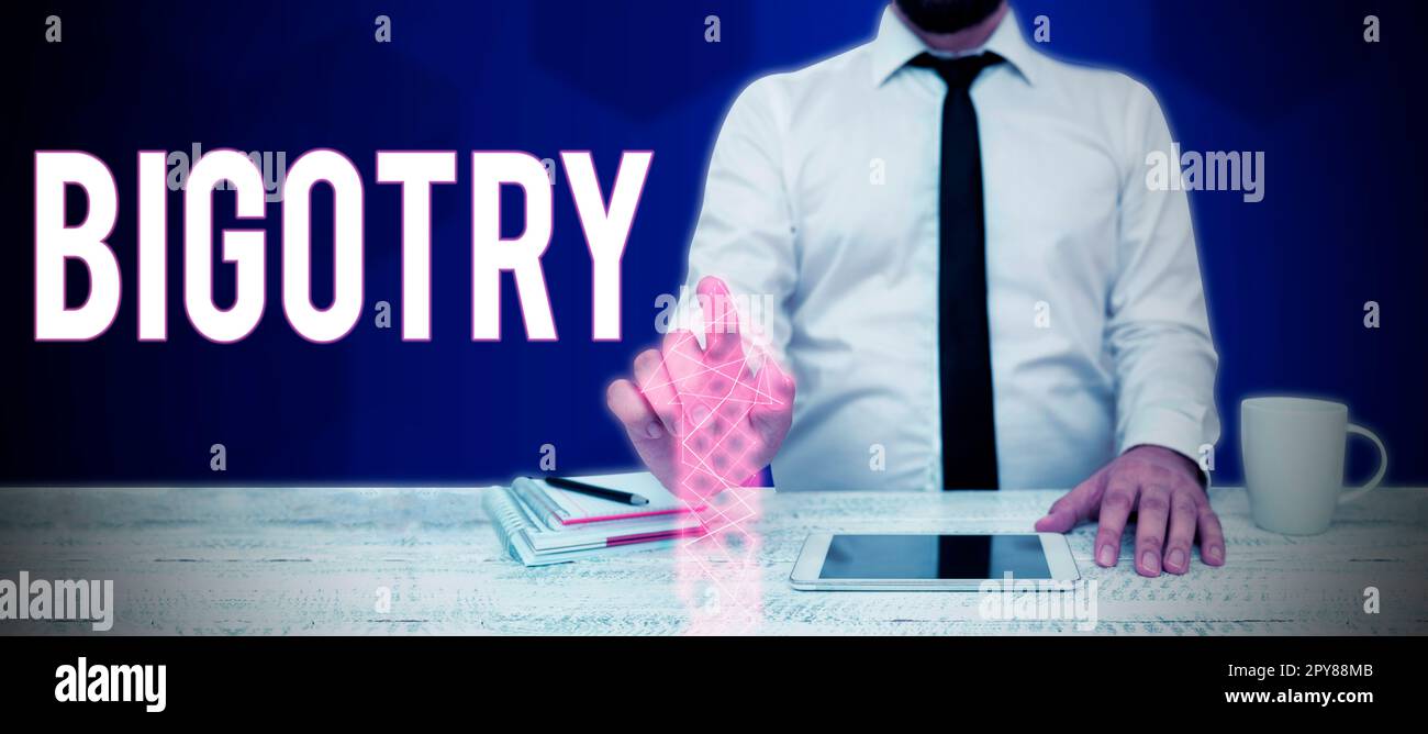 Handschriftlicher Text Bigotterie. Begriff, der starrsinnige oder intolerante Hingabe zu seinen eigenen Meinungen und Vorurteilen bedeutet Stockfoto