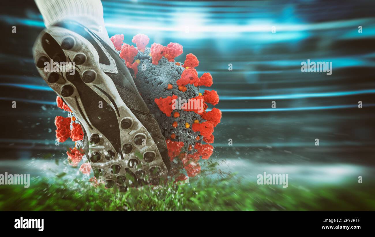 Fußballspieler treten hart den Virus Ball im Stadion Stockfoto