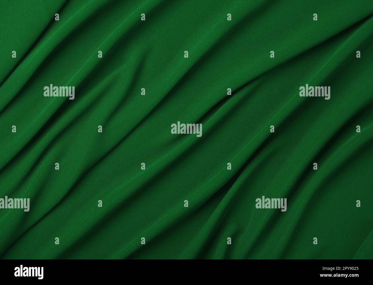 Hintergrund der grünen Textil gefalteten Falten Stockfoto