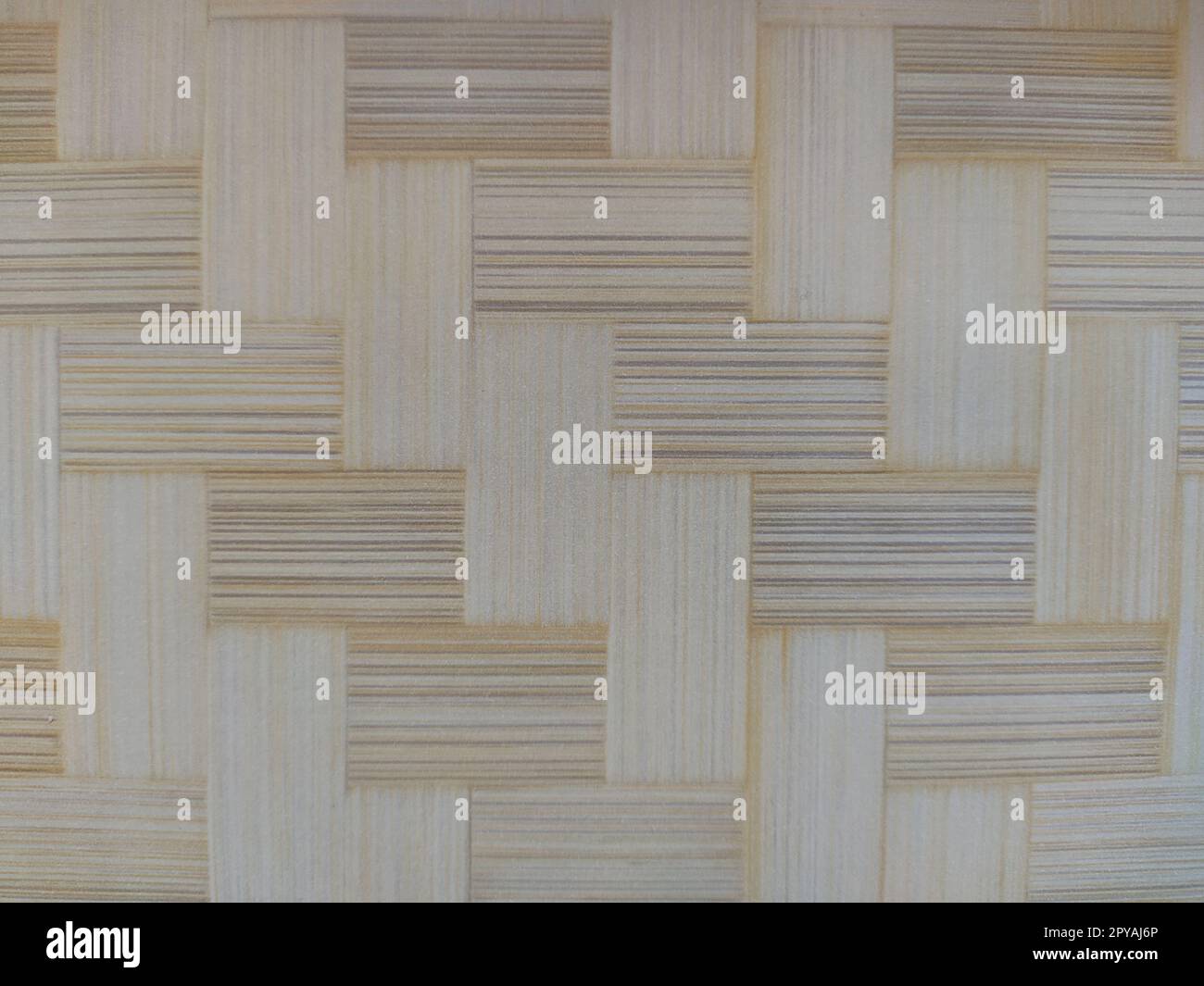 Ein Stück Parkettboden. Parkettmuster. Interlacing von Elementen. Oberfläche aus Holz, Bambus oder Rasenfilz. Heißmatte. Nahaufnahme. Stockfoto