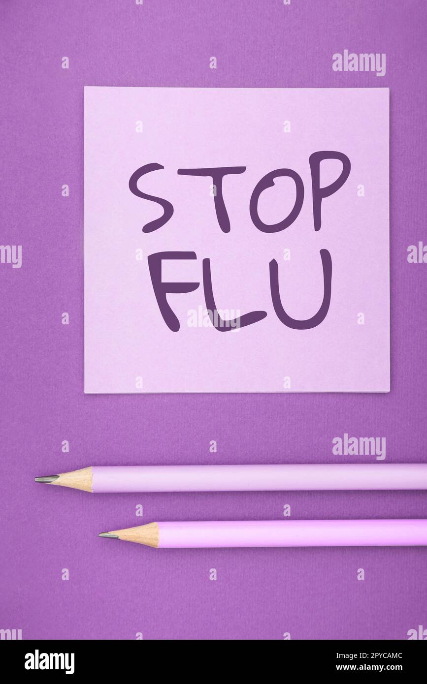 Textzeichen mit „Grippe stoppen“. Wort geschrieben über die Behandlung der ansteckenden Atemwegserkrankung durch Influenza-Virus Stockfoto