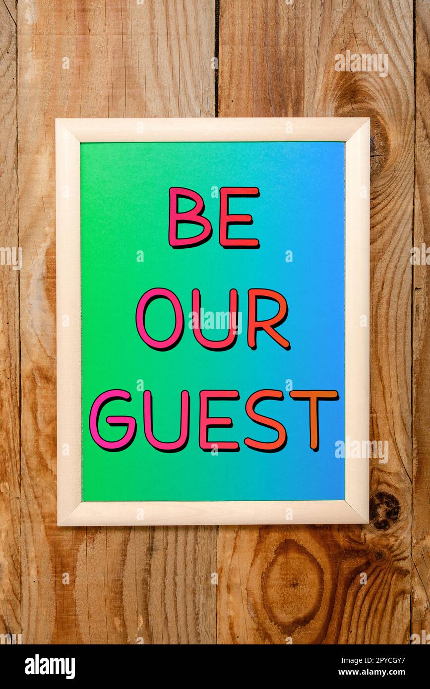 Inspiration mit Schild „Be our Guest“. Wort für Sie sind herzlich eingeladen, bei uns zu bleiben Einladung Gastfreundschaft Stockfoto