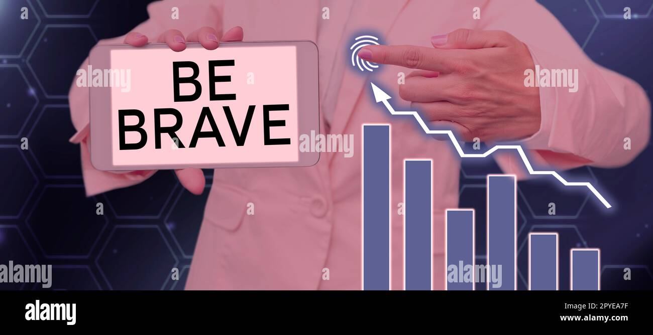 Inspiration mit dem Schild „Be Brave“. Geschäftsinitiative, die bereit ist, Gefahren oder Schmerzen zu begegnen und Mut zu zeigen Stockfoto