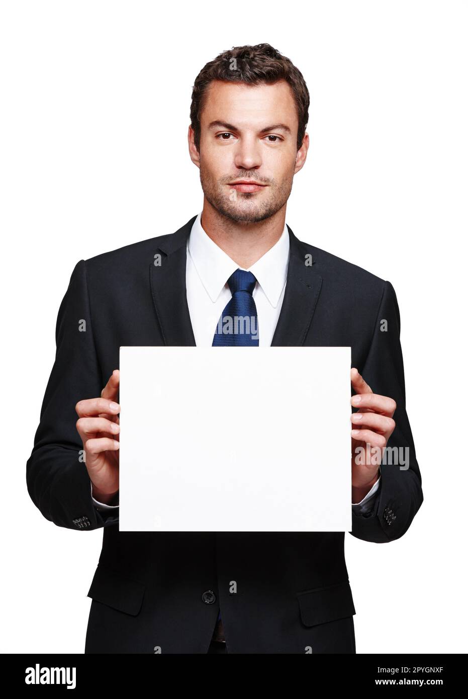 Deine Profite steigen einfach weiter. Ein gutaussehender junger Geschäftsmann mit einem leeren Plakat, isoliert auf Weiß. Stockfoto