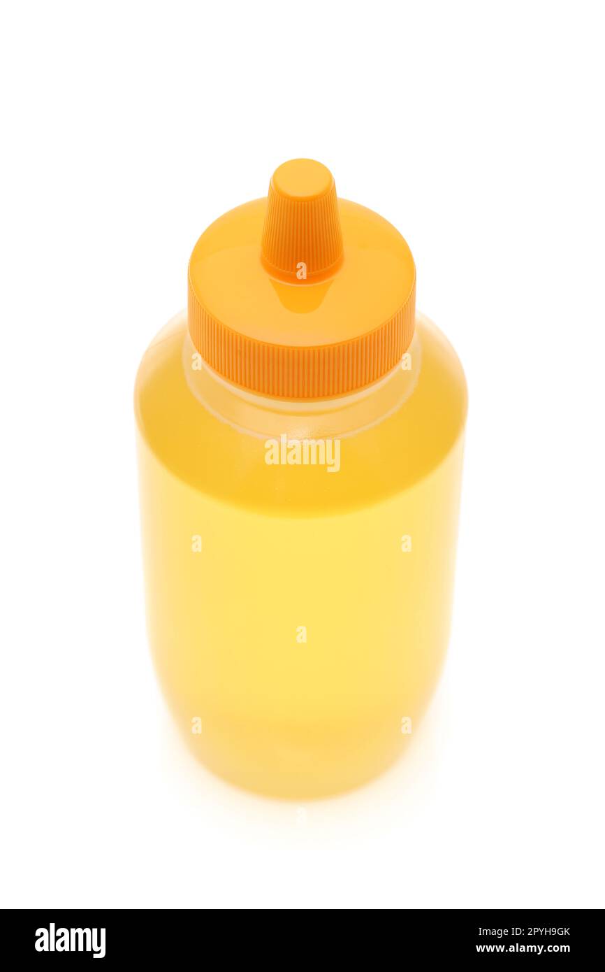 Plastikflasche Honig auf weißem Hintergrund Stockfoto