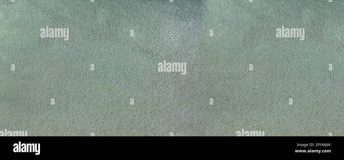 Breiter grüner Hintergrund aus Mikrofasertuch für Design in Ihrem Arbeitskonzept. Stockfoto