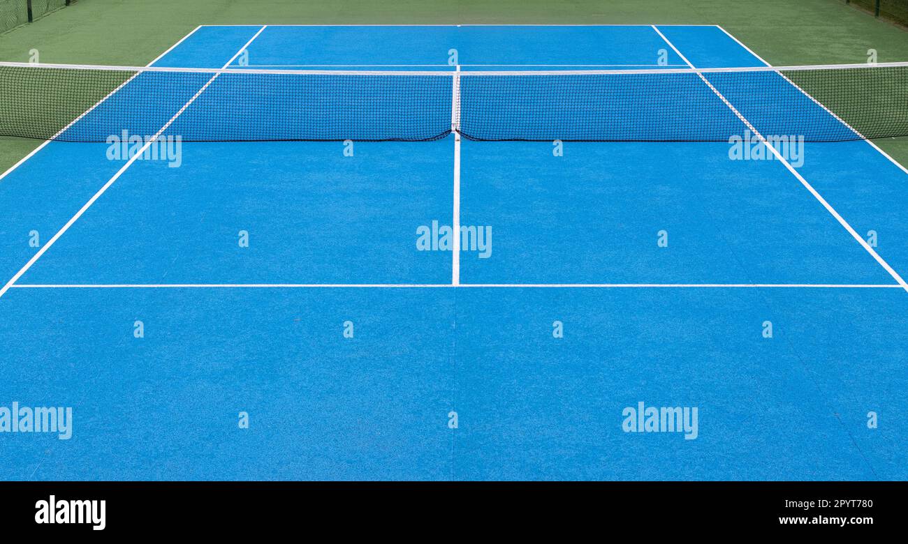 Blauer und grüner Hintergrund für Tennisplätze. Keine Menschen Stockfoto