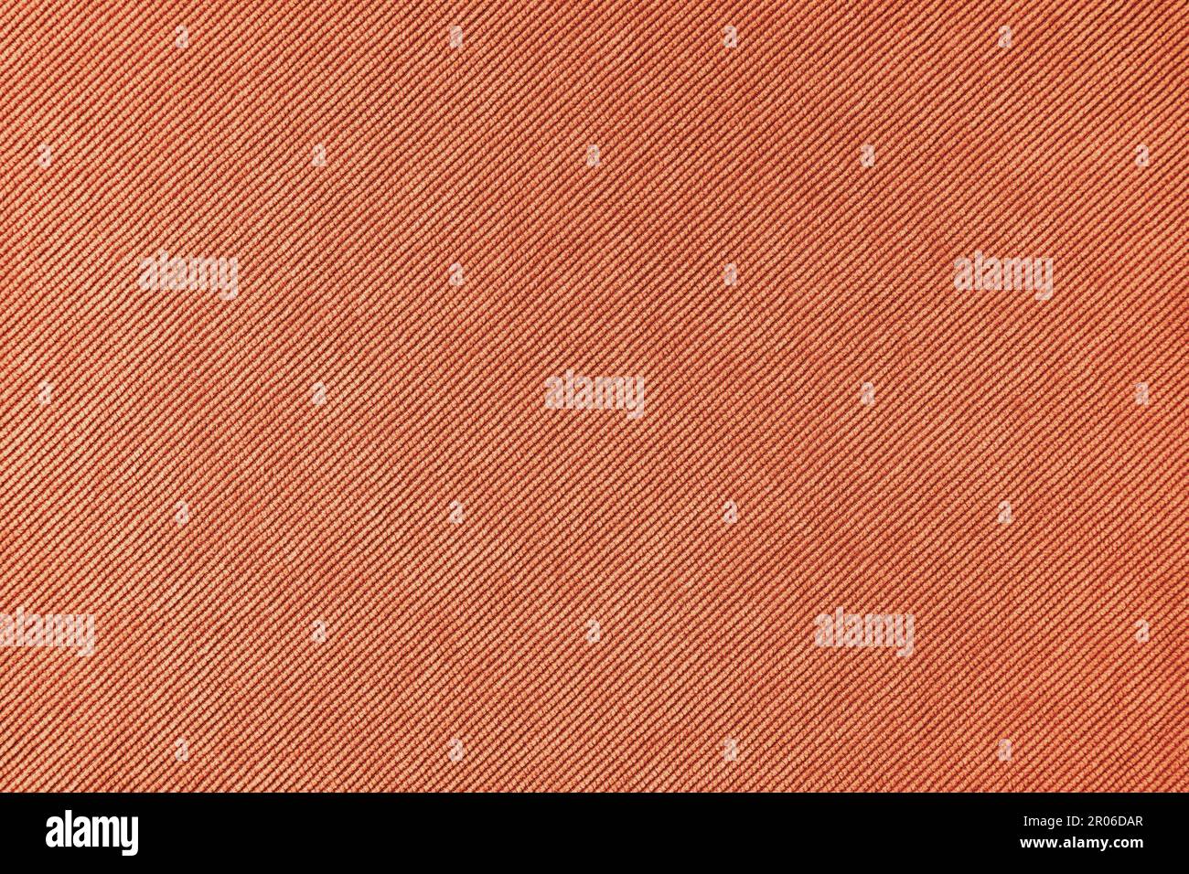 Texturhintergrund aus Velours-Orange. Polstermaterial aus Samt, Textilmaterial für Cordmöbel, Inneneinrichtung, Einrichtung. Grat f Stockfoto