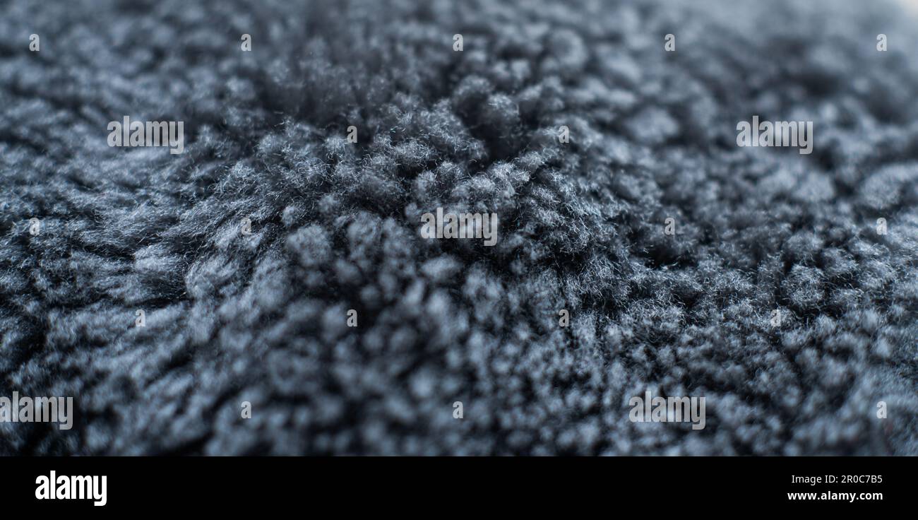 Nahaufnahme von Wollpelzgewebe in grauer Farbe Stockfoto