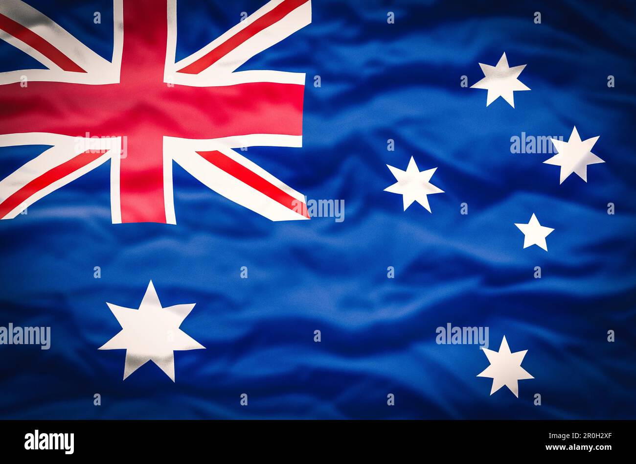 Australische Flagge auf gewelltem Stoffhintergrund. Die wellenförmige Flagge Australiens füllt den Rahmen. Stockfoto