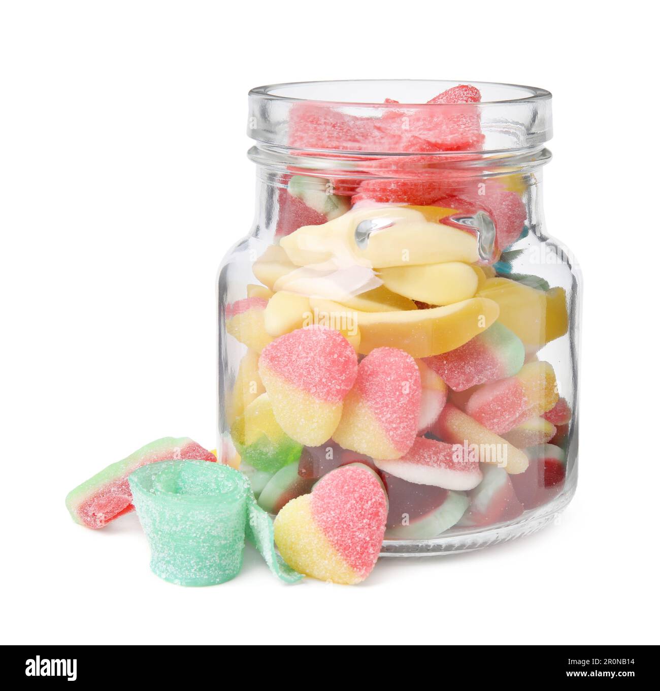 Leckere Süßigkeiten aus Gelee mit Glas auf weißem Hintergrund Stockfoto