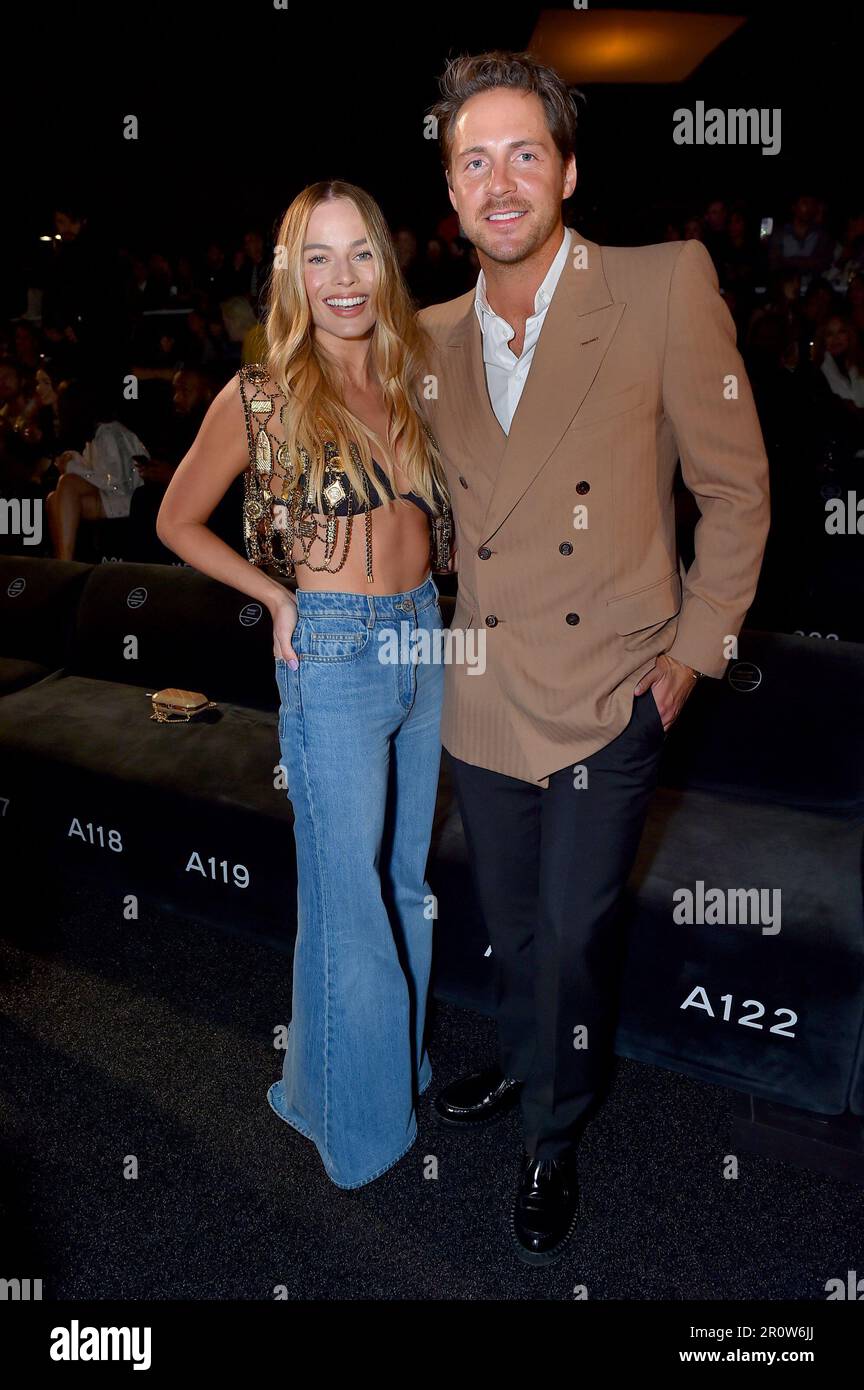 Margot Robbie, left, and Tom Ackerley attend the Chanel Cruise 2023/