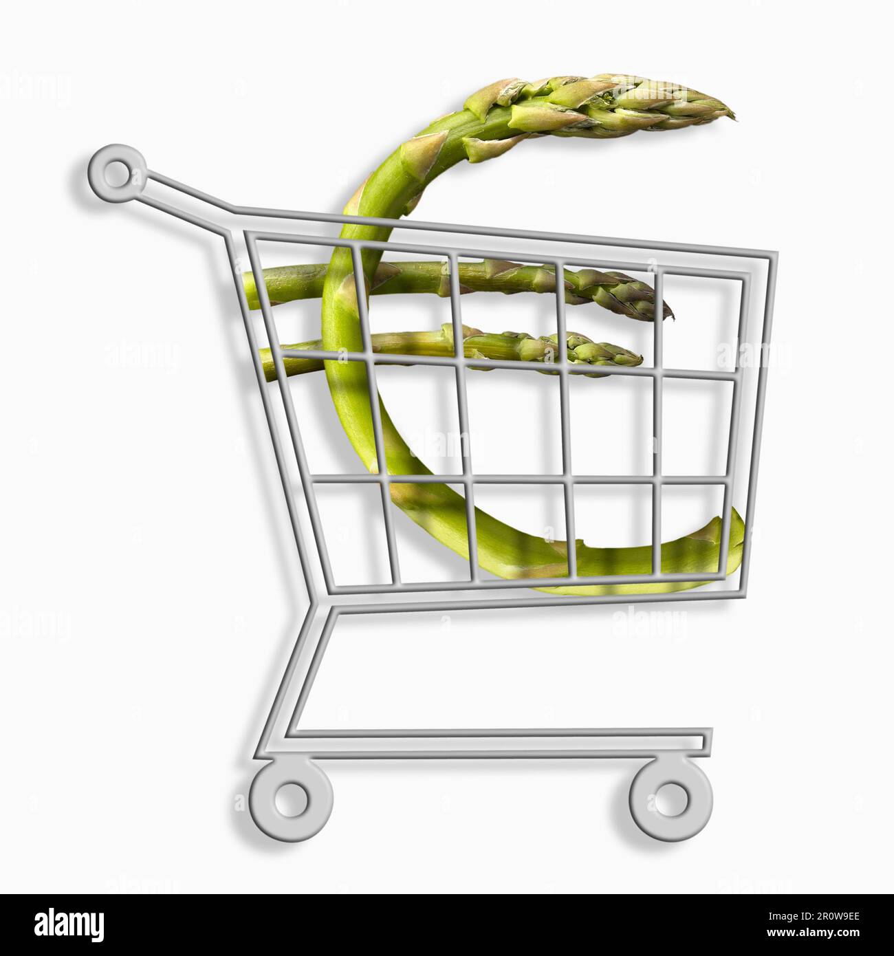 Mini-Supermarkt-Trolley mit einem ? schild mit grünem Spargel Stockfoto