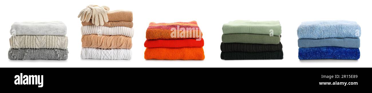 Set warmer Strickpullover auf weißem Hintergrund Stockfoto
