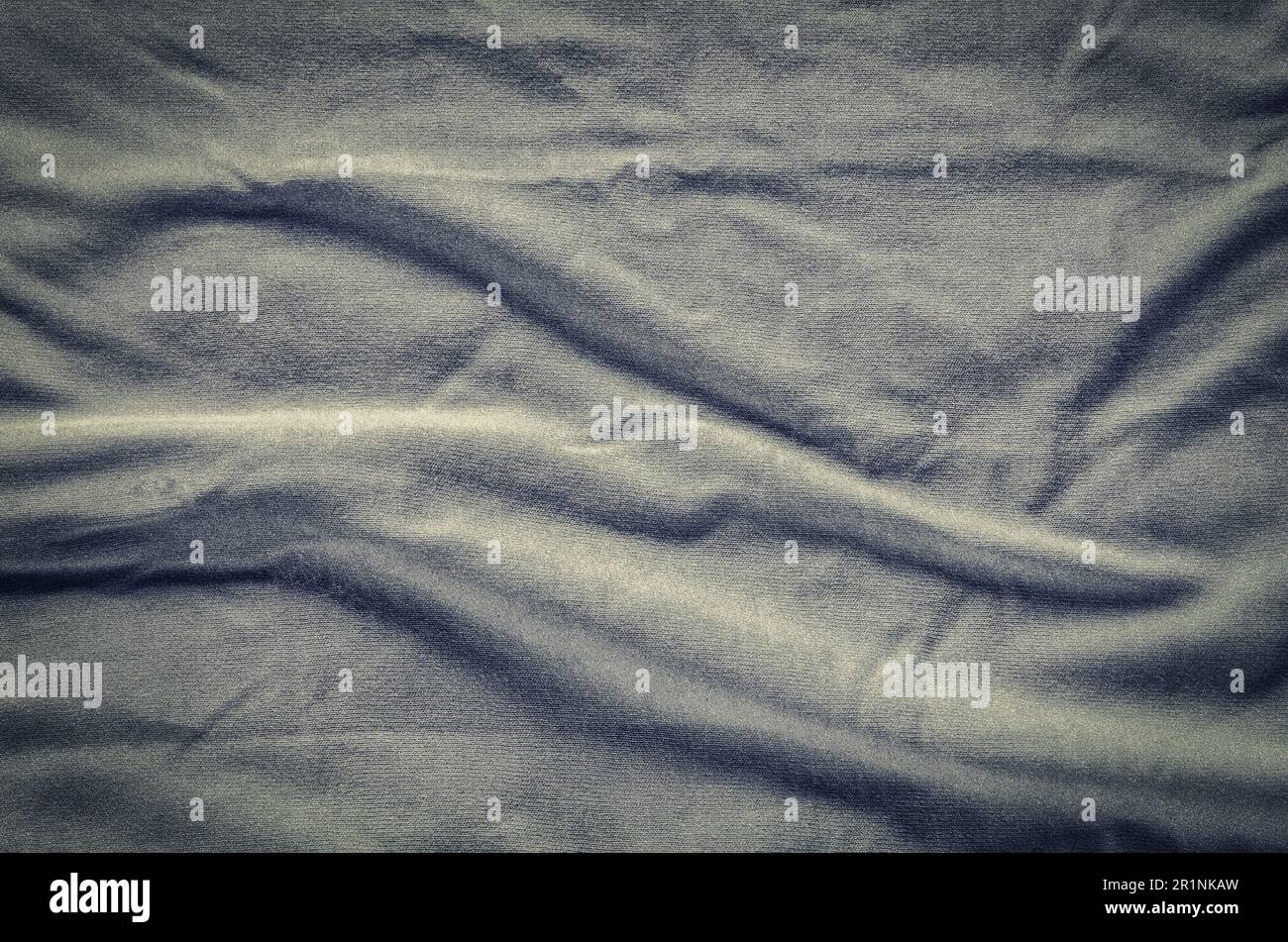 Graue faltigen Stoff Textur. Nahaufnahme von weichen Baumwolltuch werden als Hintergrund verwendet. Stockfoto