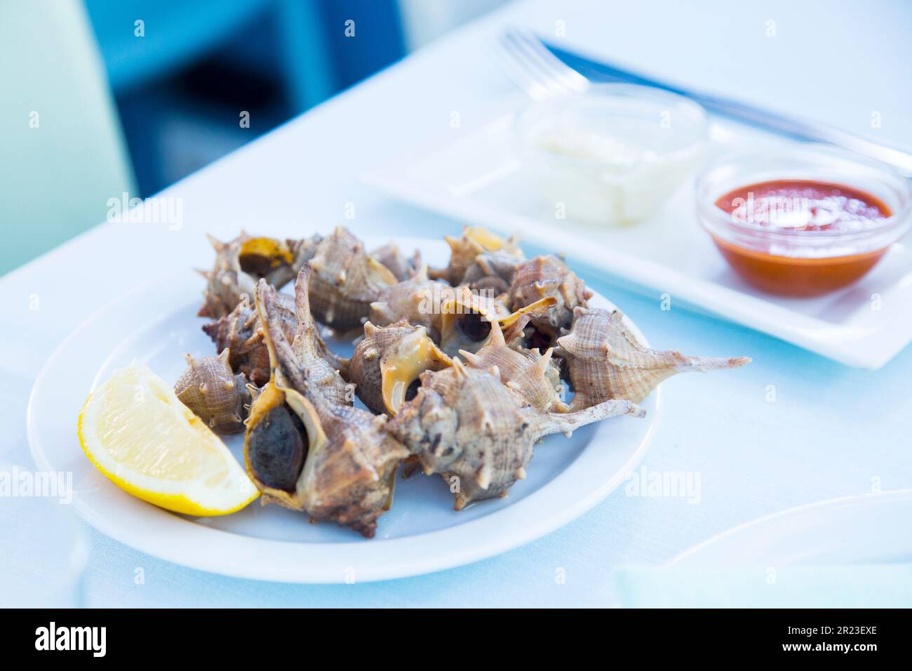 Gegrillte Meeresschnecken in einem spanischen Tapas-Restaurant. Stockfoto