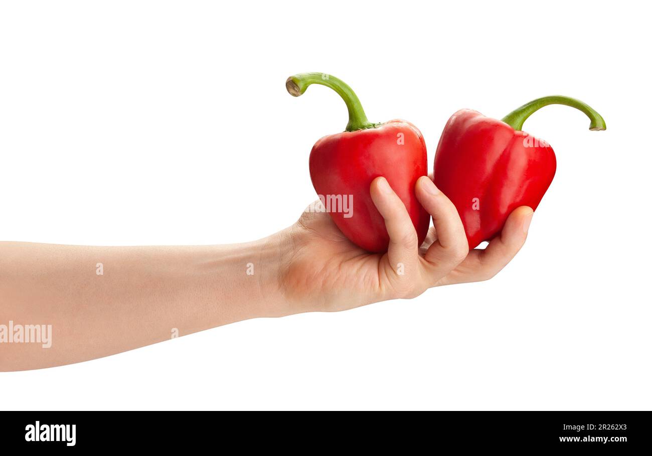 Paprika in der Hand weg isoliert auf weißem Stockfoto