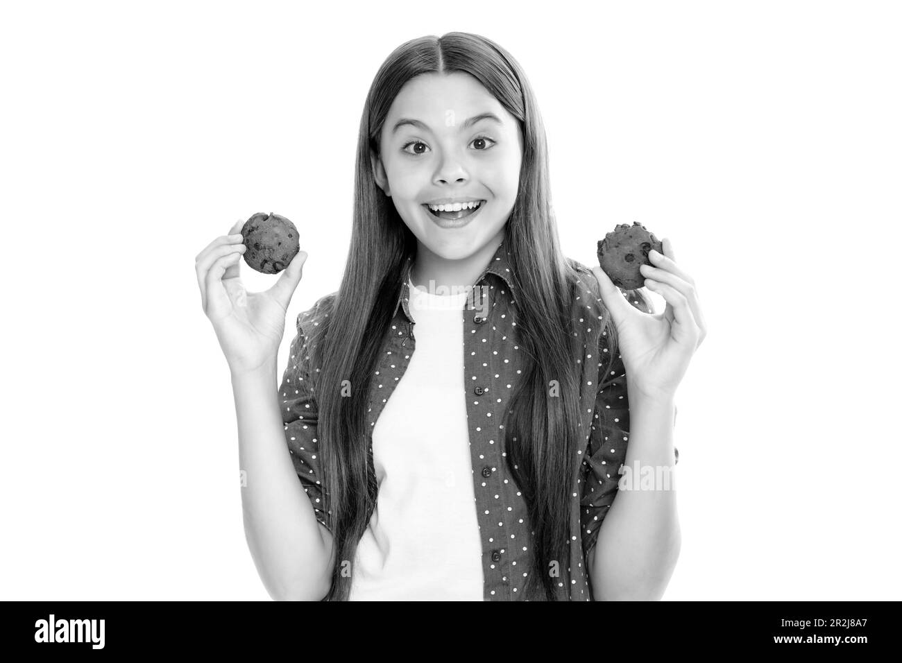 Mädchen und Kekse. Teen girl eating Cookies, Snack für Schüler. Kind mit Dessert Bäckerei Porträt von glücklich lächelnd Teenager-Kind Mädchen essen cooki Stockfoto