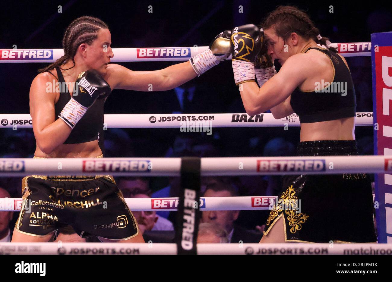 Britain's Chantelle Cameron, left, lands a punch on Ireland's Katie Taylor during their light-welterweight boxing world title fight at the 3Arena in Dublin, Ireland, Saturday, May 20, 2023.(AP Photo/Peter Morrison) Stockfoto