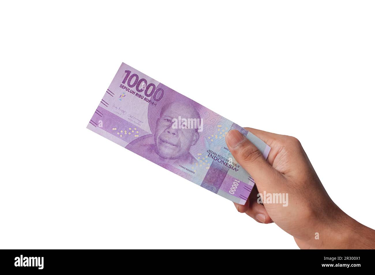 Hand mit zehntausend Rupien-Noten isoliert auf weißem Hintergrund Stockfoto