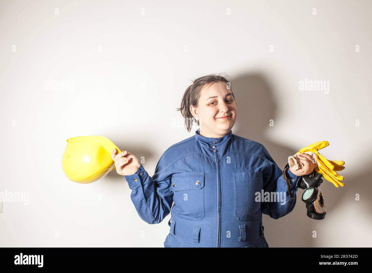 Weibliche harte Arbeiterin liebt ihren Job Stockfoto