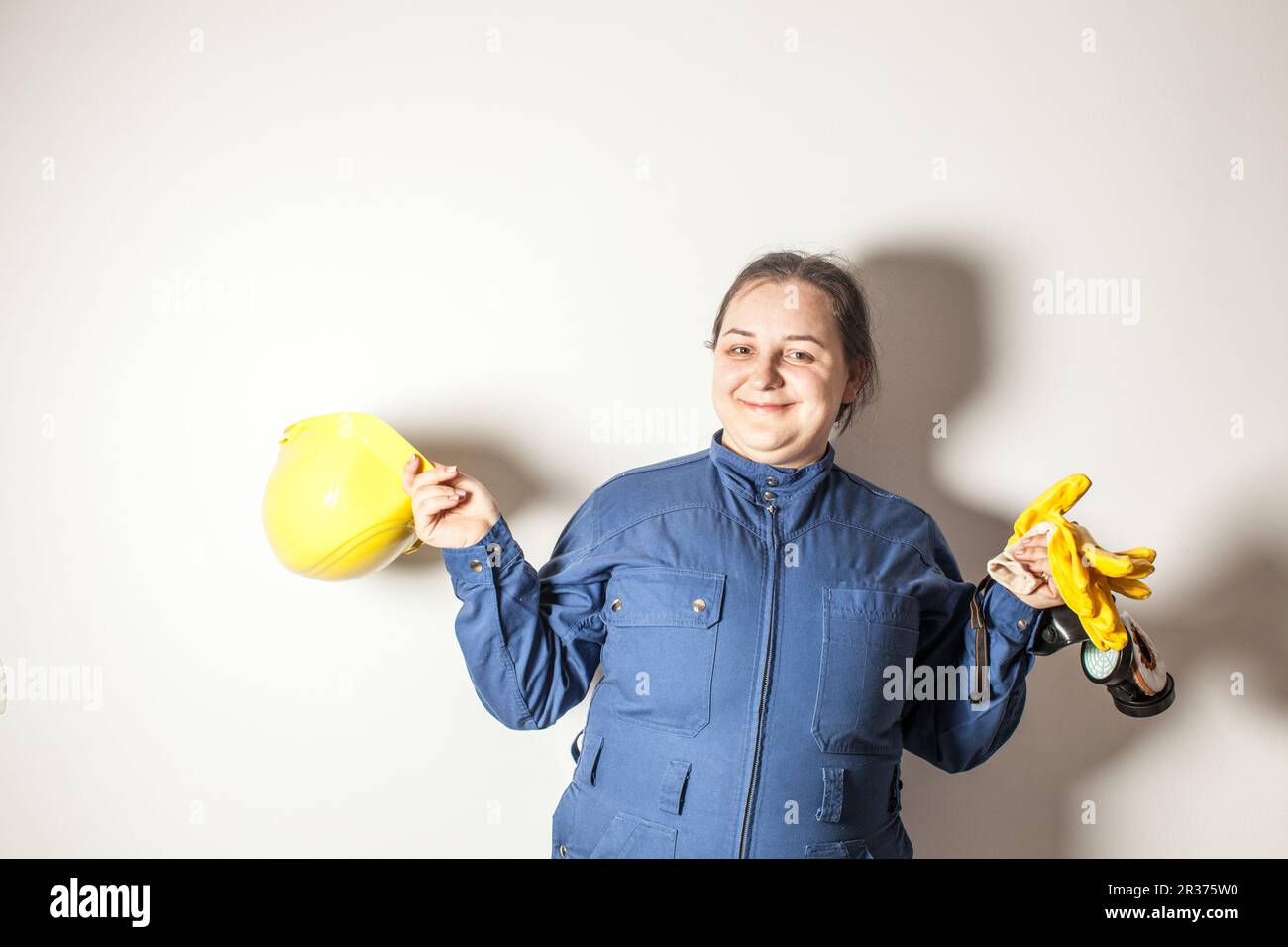 Weibliche harte Arbeiterin liebt ihren Job Stockfoto