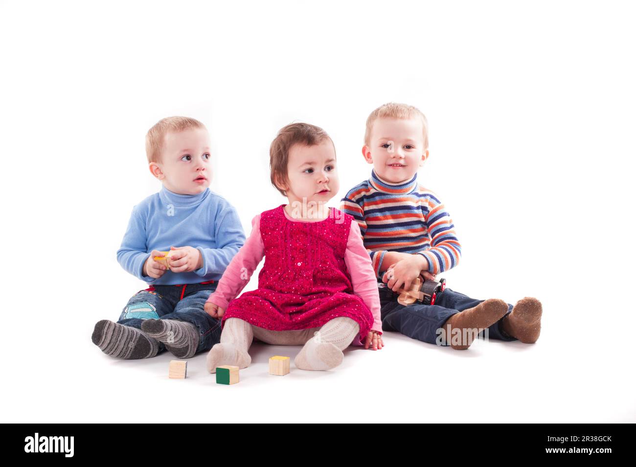 Drei Kinder spielen Stockfoto