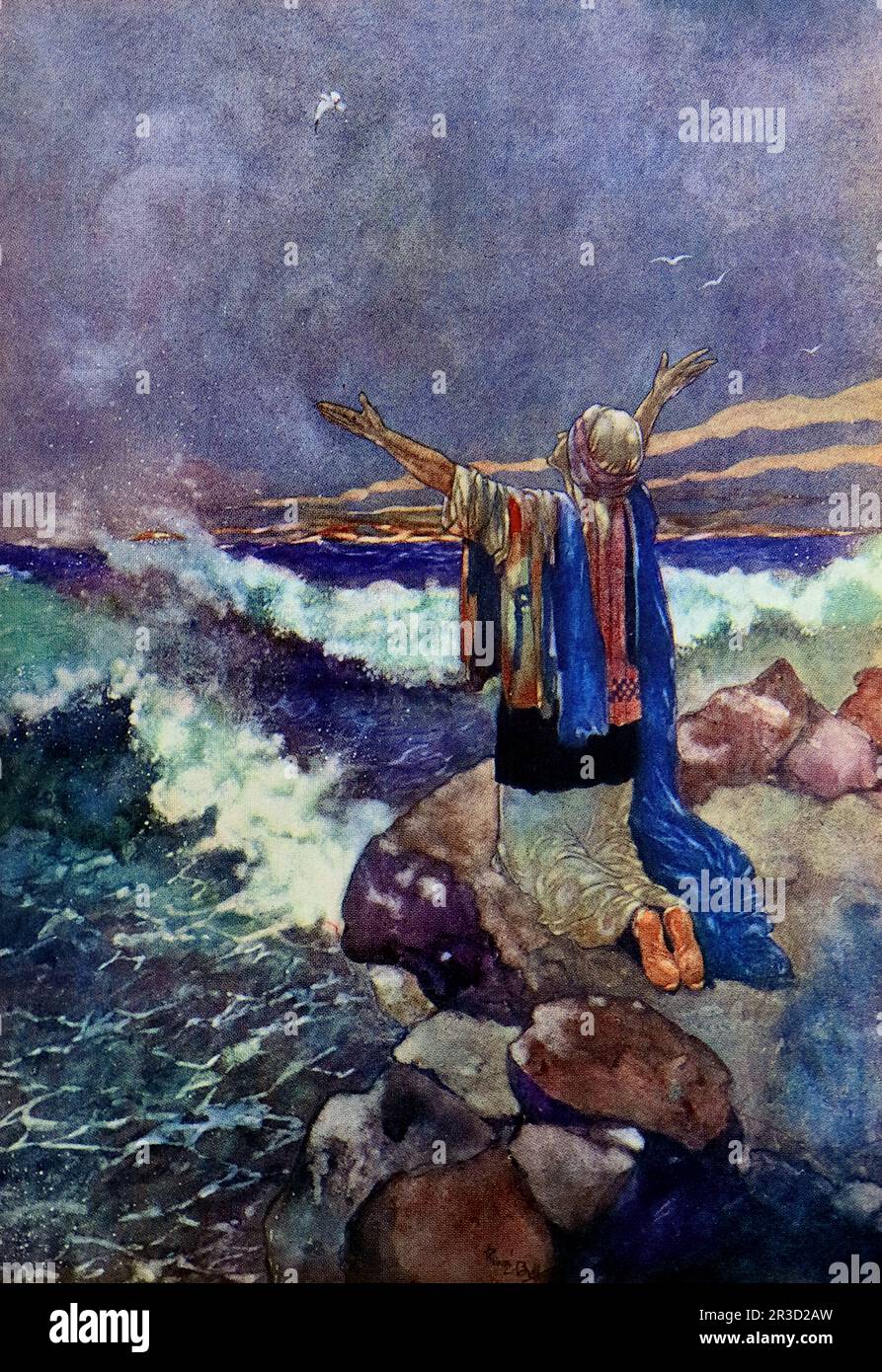 Von Rene Bull Ein Mann auf einem Felsen am tosenden Meer, seine Arme weit über dem Himmel gestreckt. Vom Rubaiyat von Omar Khayyam. Stockfoto
