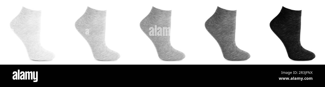 Set mit verschiedenen Socken auf weißem Hintergrund. Bannerdesign Stockfoto
