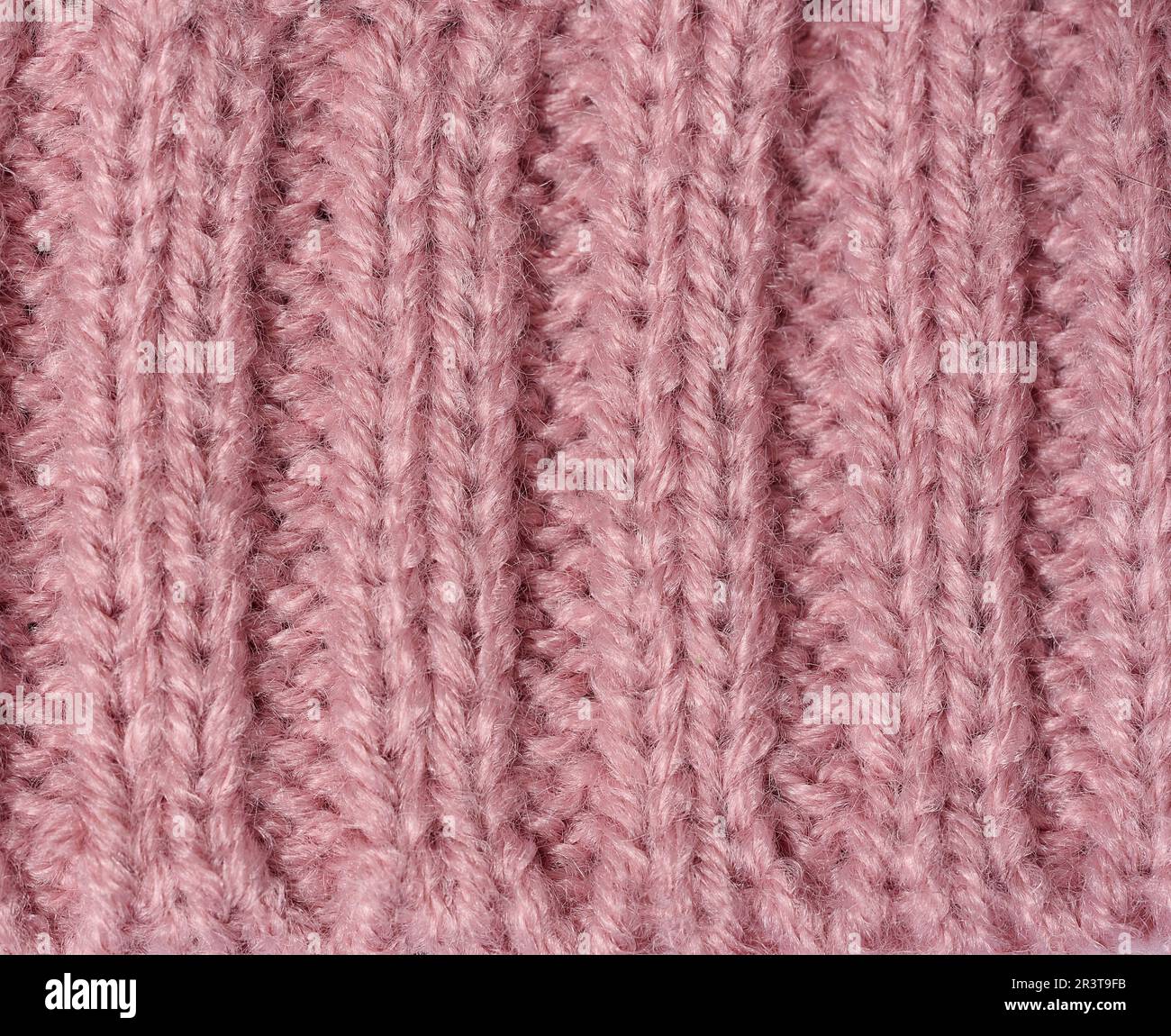 Struktur aus rosa Strickmaterial Stockfoto