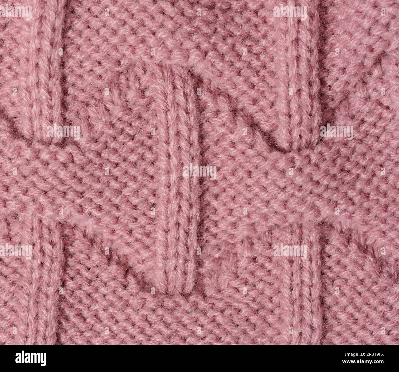 Struktur aus rosa Strickmaterial Stockfoto