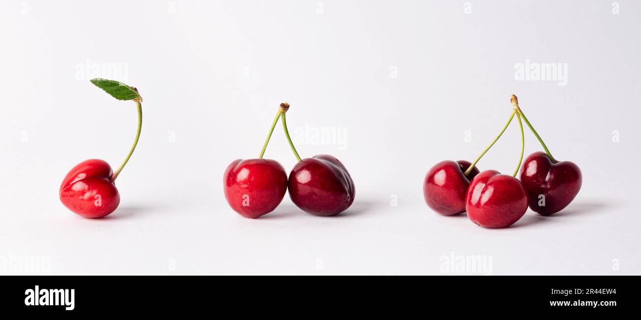 Gesunde rote Kirschen auf weißem Hintergrund isoliert. Kirschen, rote Früchte Stockfoto