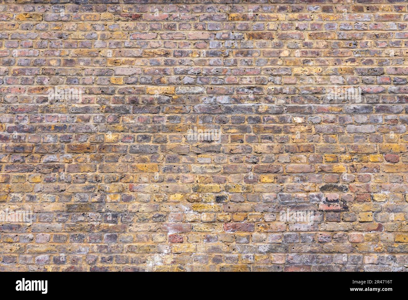 Alte verwitterte Ziegelwandtextur. Grunge Stadtmauern Stockfoto