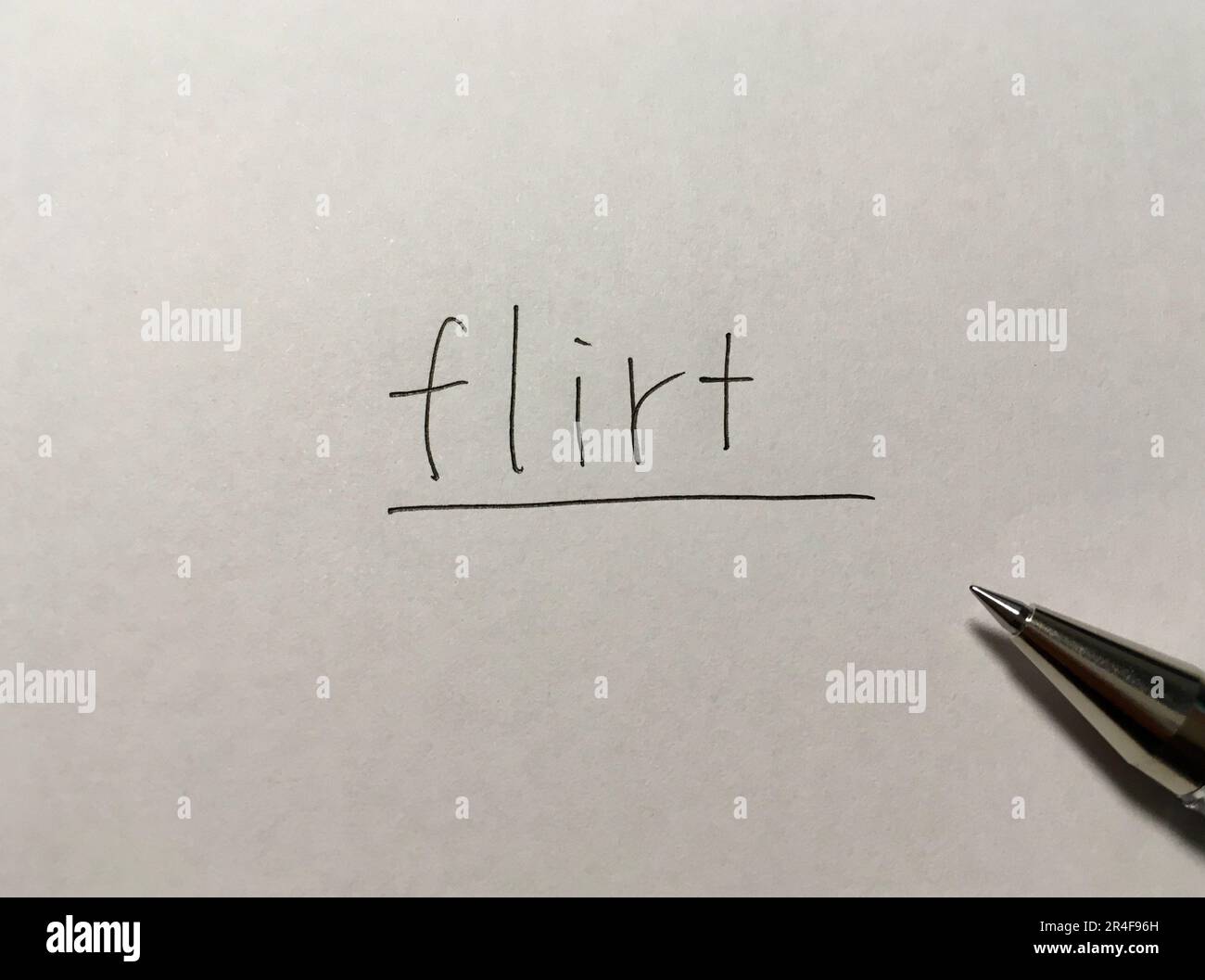 Flirt-Konzeptwort auf Papierhintergrund Stockfoto
