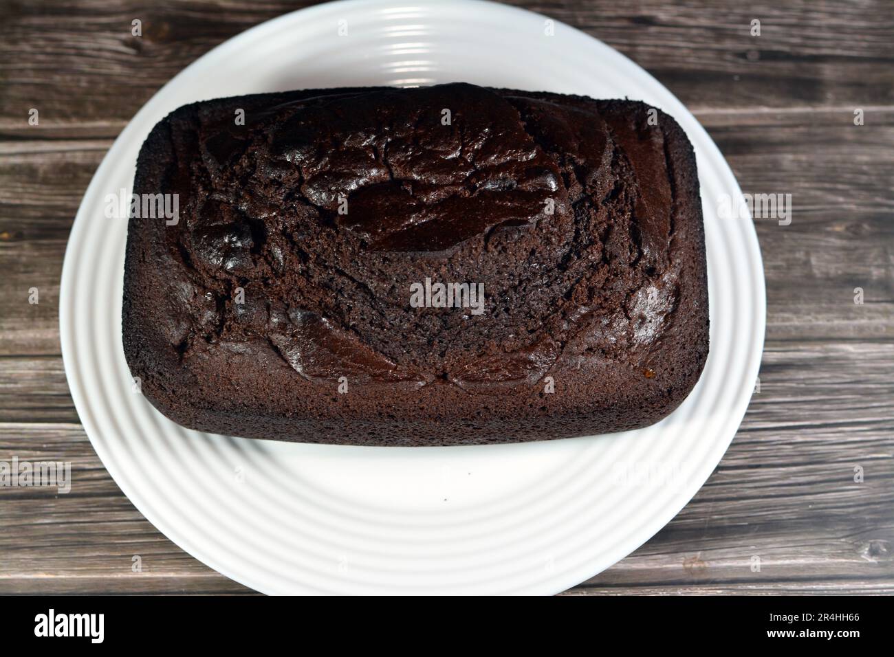 Schokoladenkuchenmischung, köstliche hausgemachte Kuchen, reichhaltige Proteinquelle, Kohlenhydrate, Zucker, Energie, aromatische Leckereien für Gelegenheiten, verpackt in Food-Gra Stockfoto