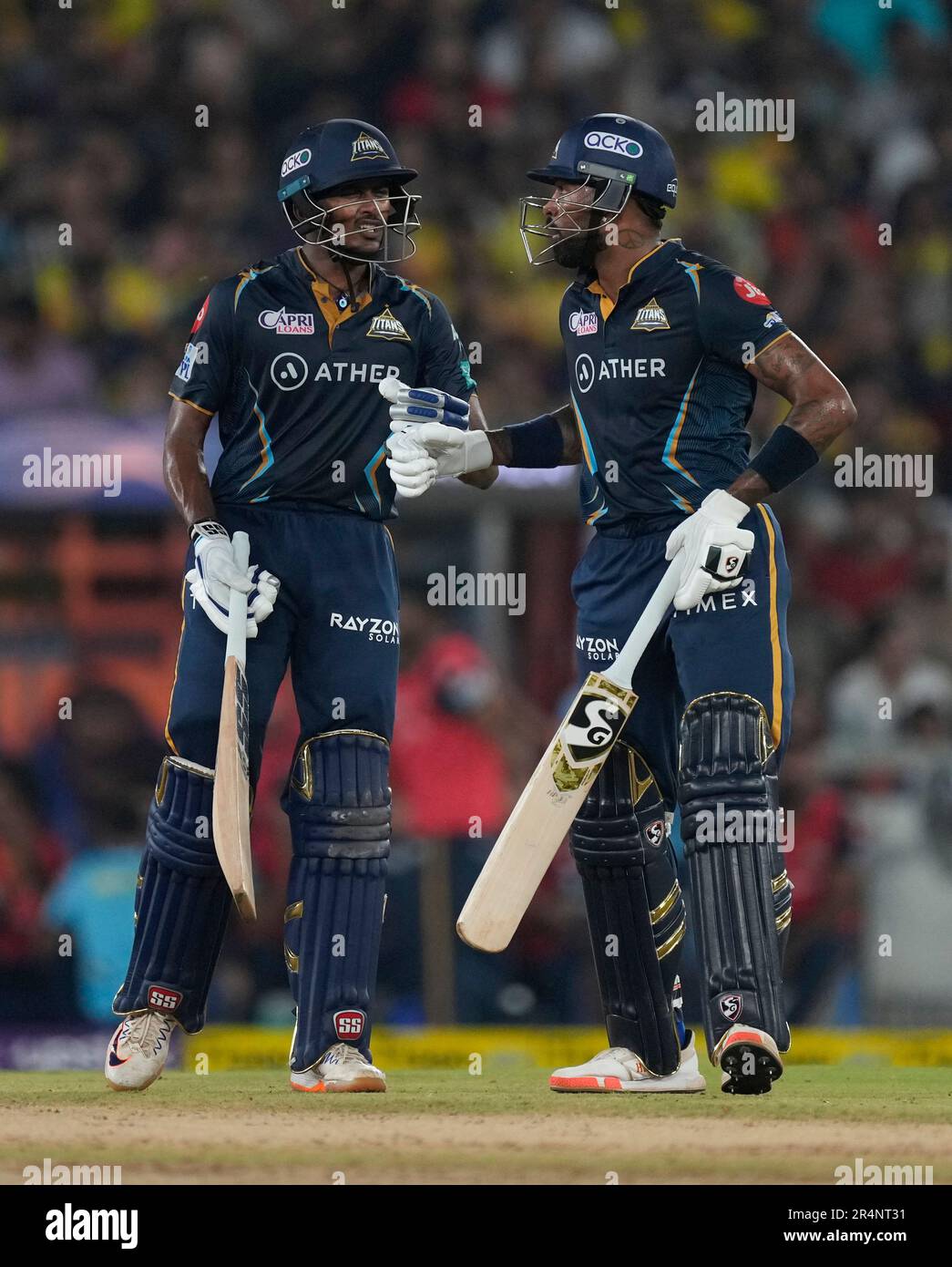 Gujarat Titans' Sai Sudharsan, left, and captain Hardik Pandya