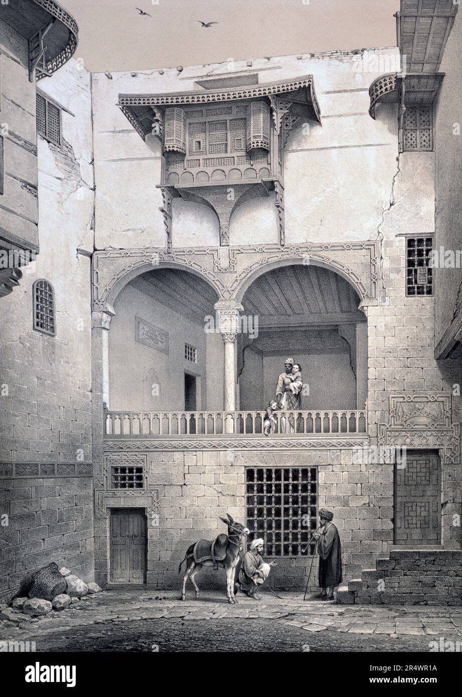 Haus namens Beyt-el-Tcheleby, Kairo, Ägypten: Fassade mit Blick auf den Innenhof, XVIII Jahrhundert. Lithographie aus "L'Art arabe d'Apres les Denkmäler du Caire" 1869-1877 von Emile Prisse d'Avennes, (1807-1879), französischer Architekt und Ingenieur. Stockfoto