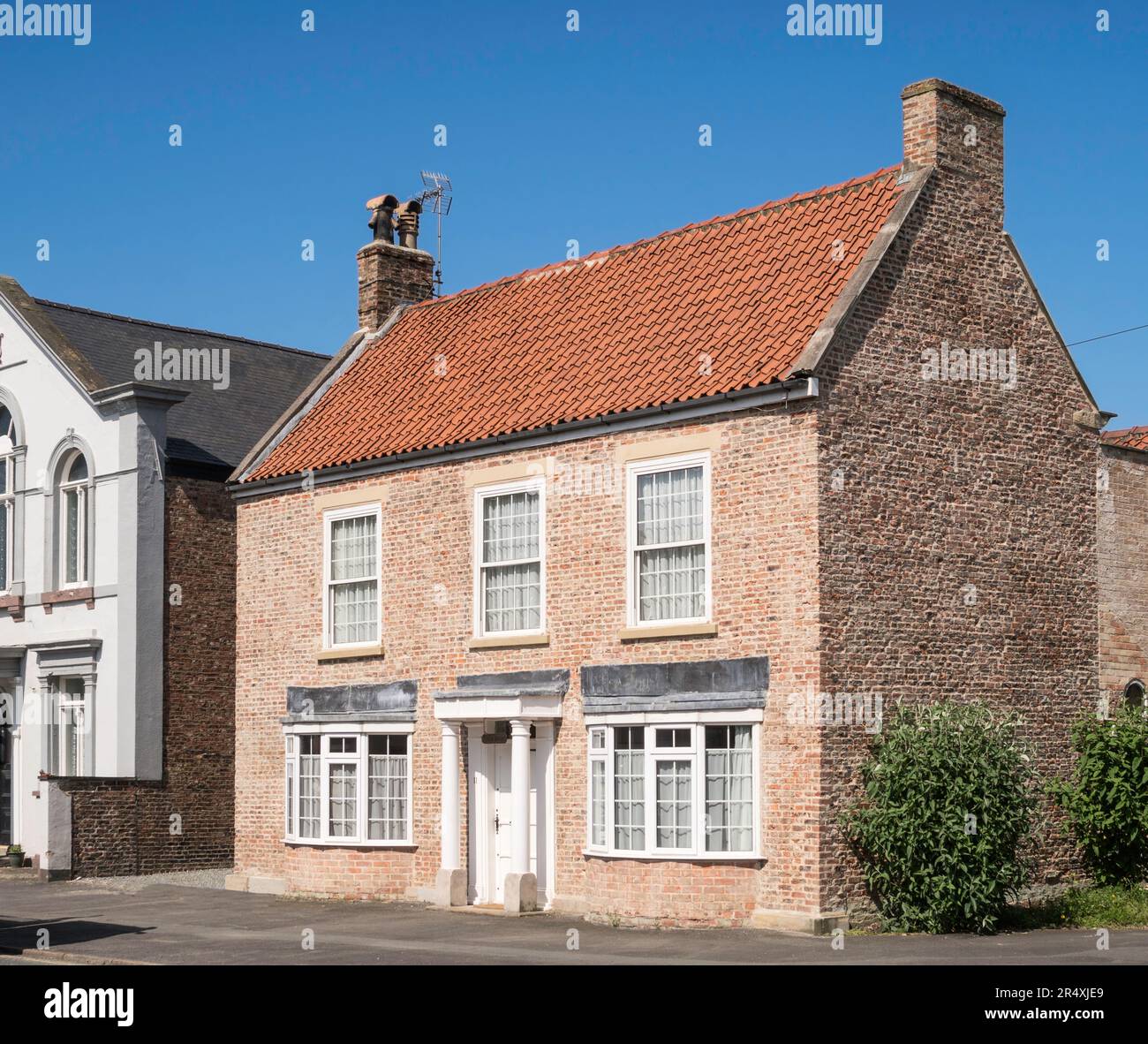 Wells House ein Stadthaus mit doppelter Fassade in Pocklington, East Riding of Yorkshire, England, Großbritannien Stockfoto