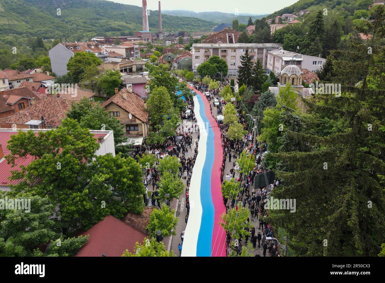People hold a giant Serbian flag during a protest in the town of Zvecan ...