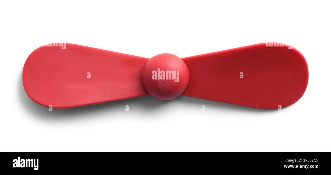 Red Toy Propeller ist auf White ausgeschnitten. Stockfoto