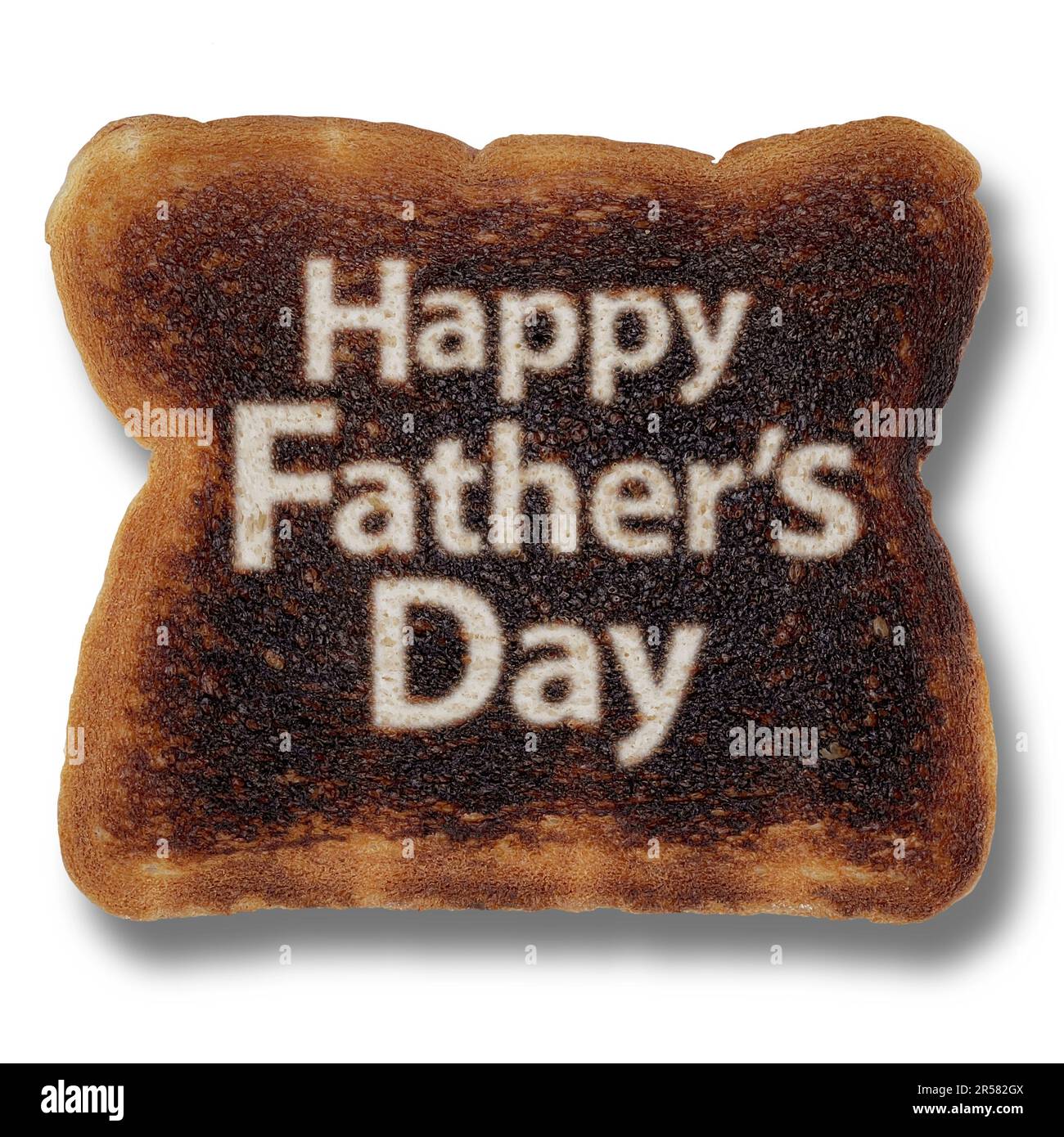 Lustiges Vatertag-Symbol als verbrannter Toast mit Feiertagsfeier und väterlichen Symbolen für Papa oder Daddy, die Papa als Koch für Elternschaft ehren Stockfoto