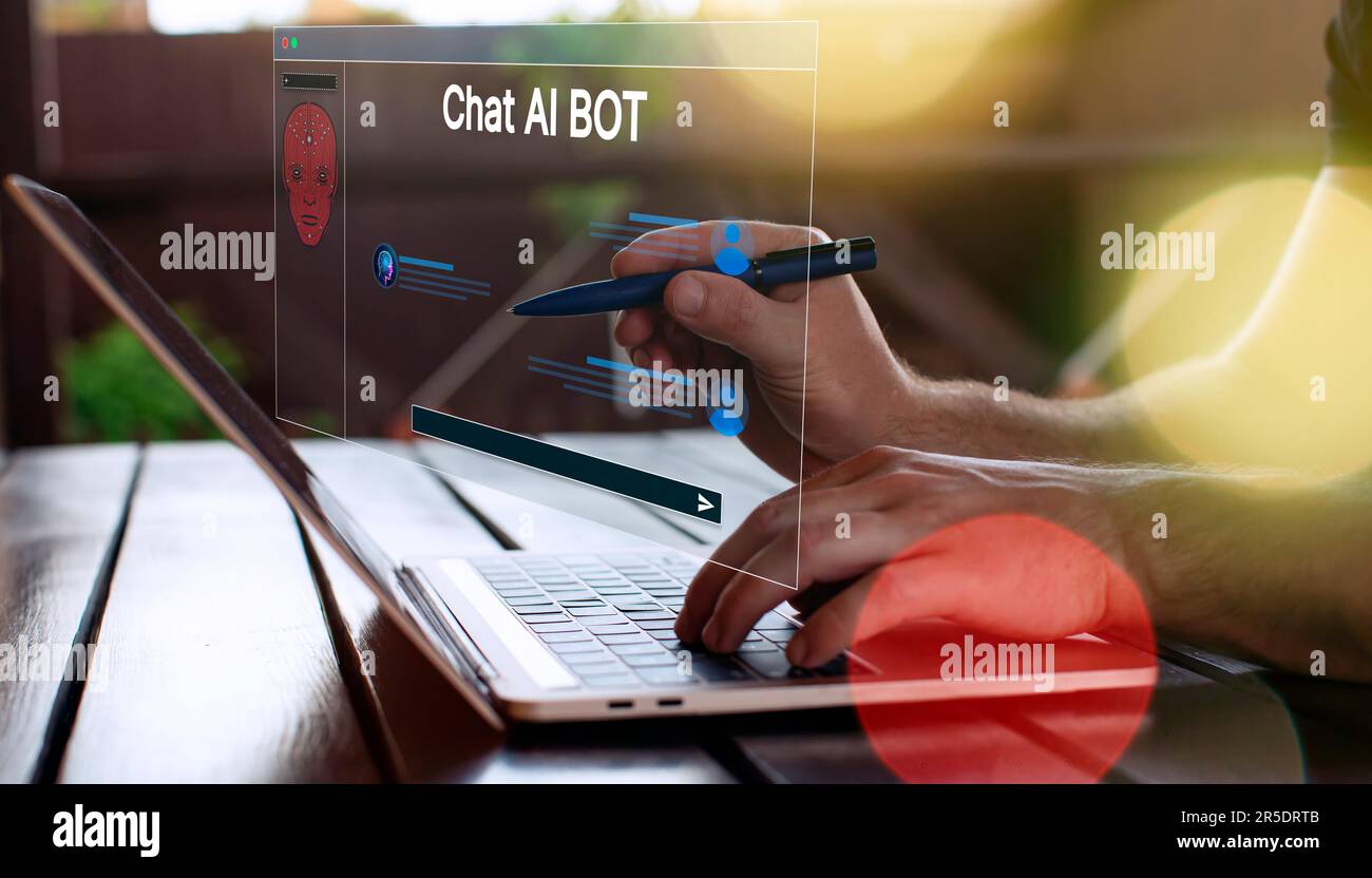 Geschäftsmann, der mit einem Laptop chattet Stockfoto